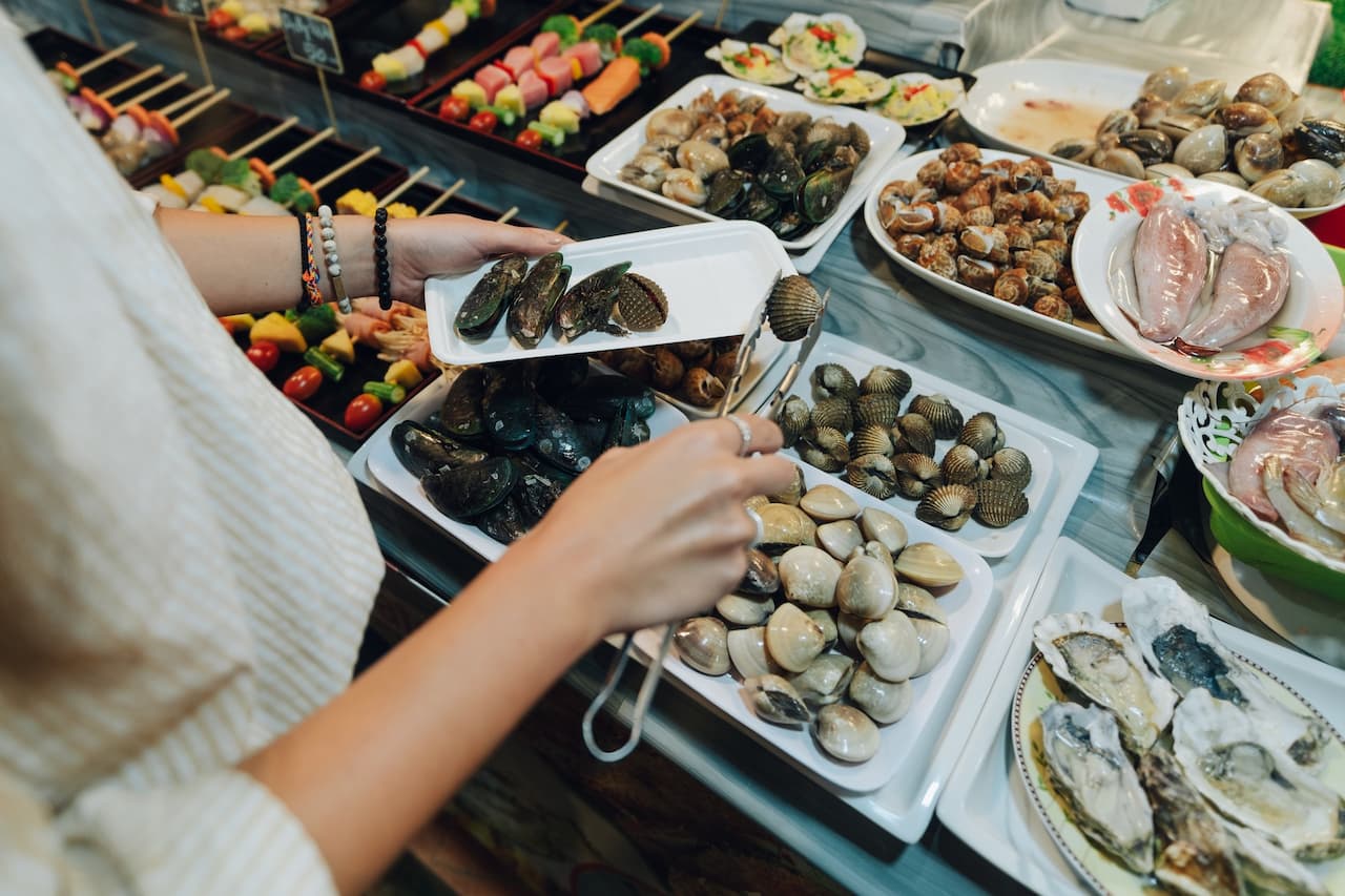Person Getting A Shellfish What Eats Shellfish